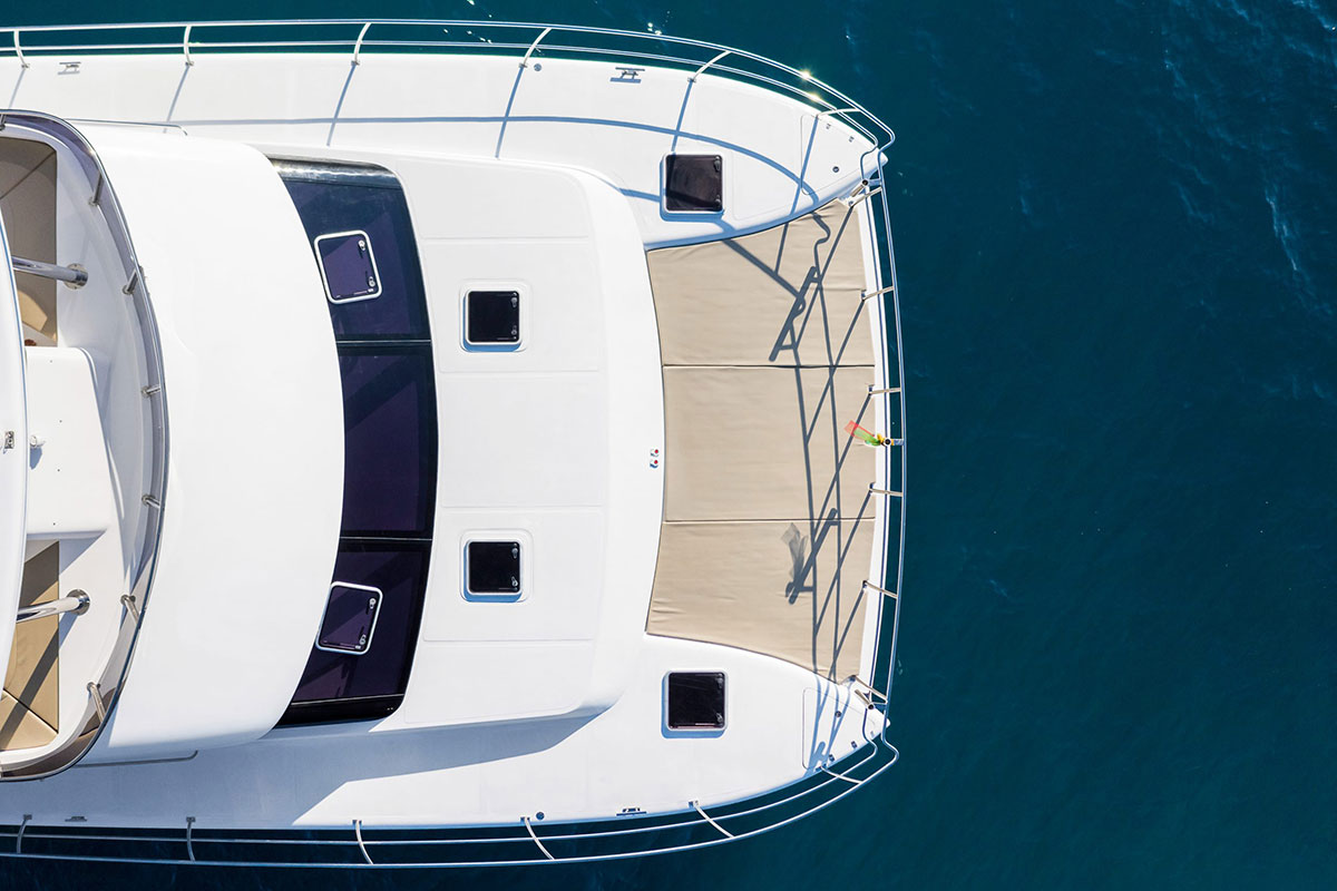 Spacious deck of 15-metre power catamaran - luxury charter Samui