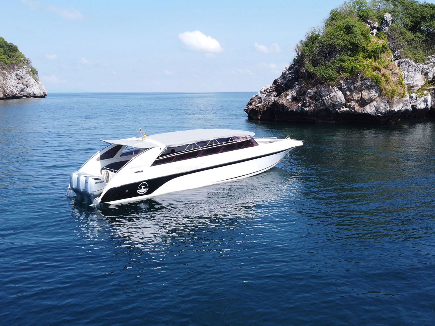 Aerial shot of 3-engine speedboat